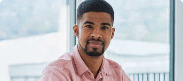 Young professional African American man looking at camera and smiling